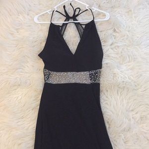 Sleek black prom dress that ties around the back.